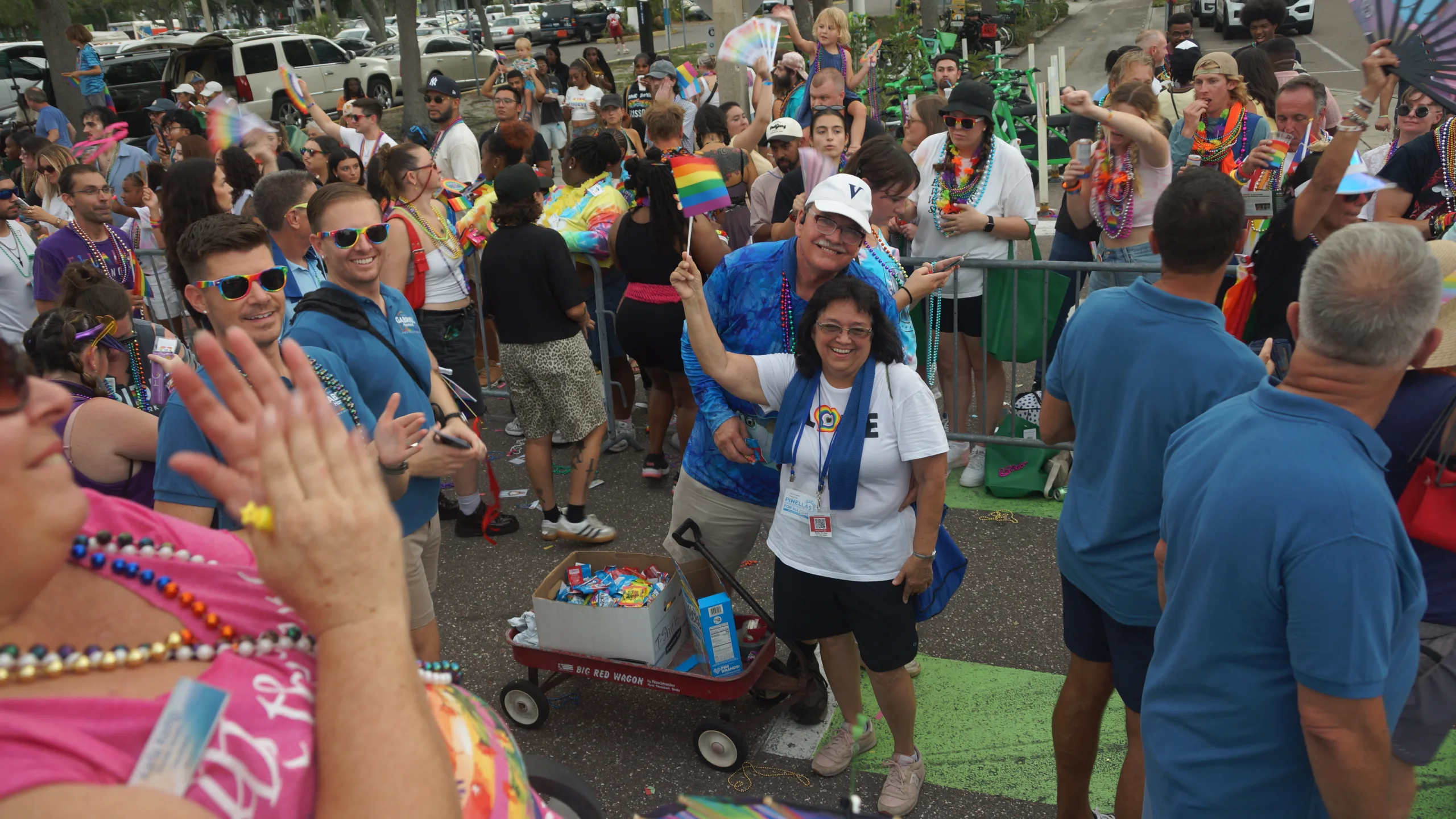 Sharon and other parade participants waving to the crowd at the St. Petersburg Pride Parade.